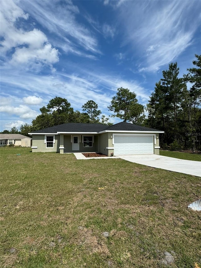 ranch-style house featuring a garage and a front lawn