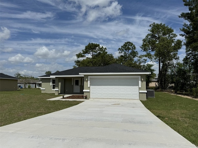 ranch-style home with central AC unit, a garage, and a front yard