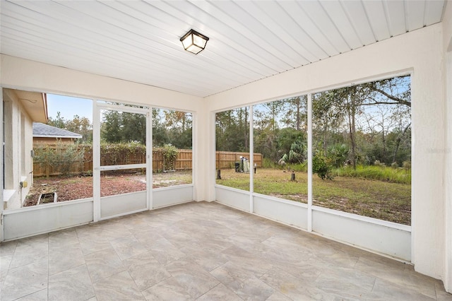 unfurnished sunroom with a wealth of natural light