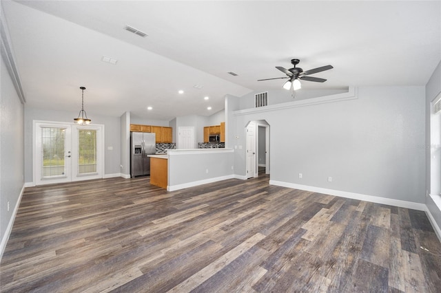 unfurnished living room with french doors, ceiling fan, dark hardwood / wood-style flooring, and lofted ceiling