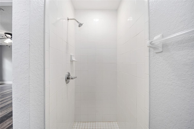 bathroom featuring tiled shower