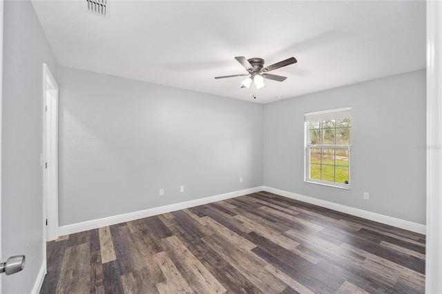 empty room with dark hardwood / wood-style floors and ceiling fan