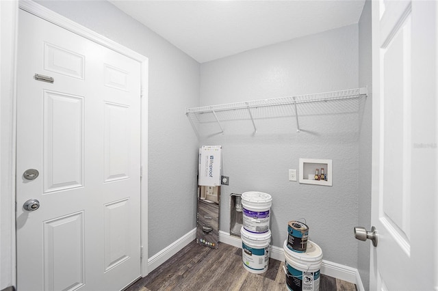 laundry room featuring hookup for a washing machine, dark hardwood / wood-style flooring, and hookup for an electric dryer