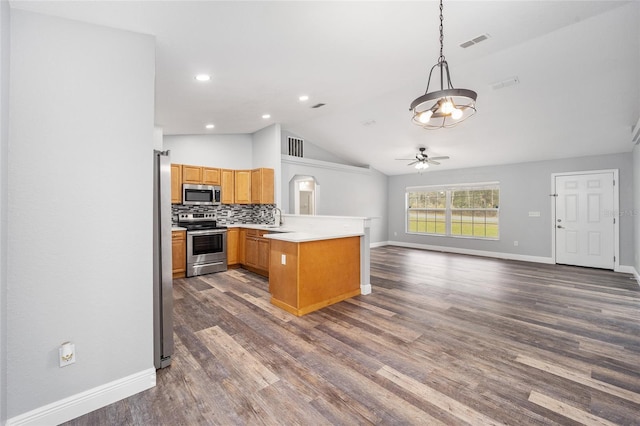 kitchen with kitchen peninsula, tasteful backsplash, stainless steel appliances, hanging light fixtures, and lofted ceiling