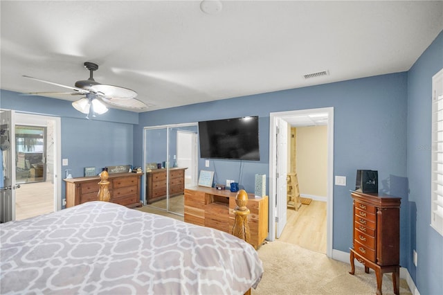 bedroom featuring ceiling fan and light hardwood / wood-style flooring