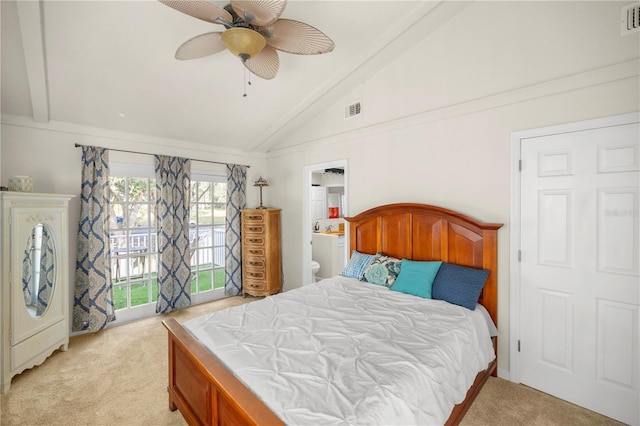 carpeted bedroom featuring ceiling fan, vaulted ceiling with beams, and ensuite bathroom