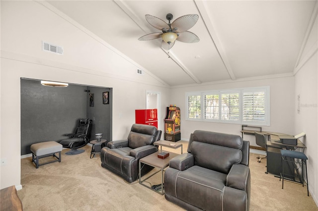 carpeted living room with ceiling fan and vaulted ceiling