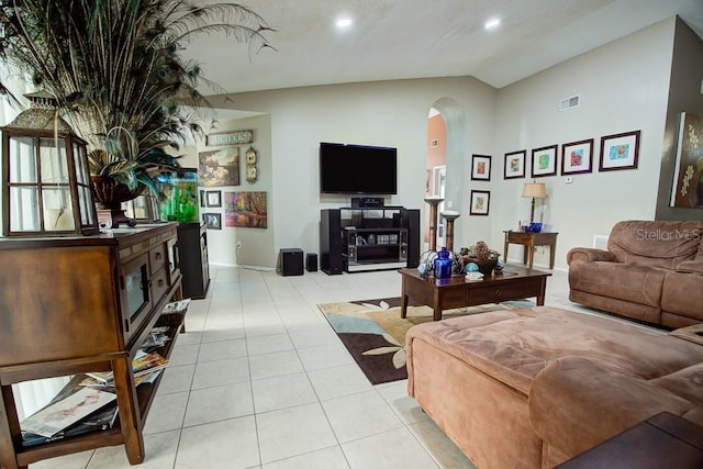 tiled living room featuring vaulted ceiling