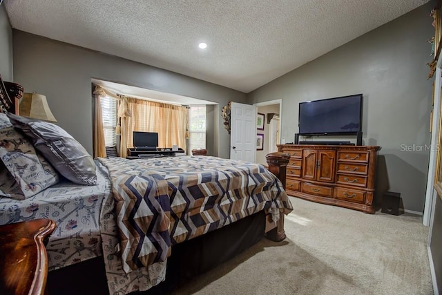 carpeted bedroom featuring lofted ceiling and a textured ceiling