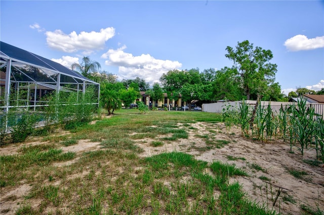 view of yard with a lanai