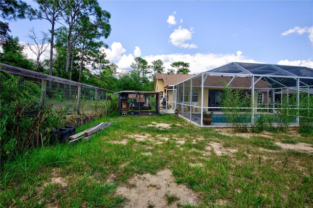 view of yard featuring a lanai