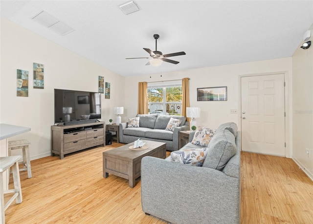 living room with ceiling fan and light wood-type flooring