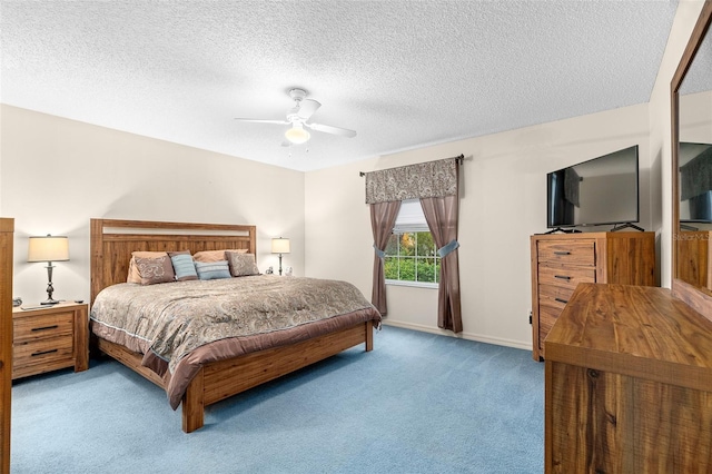 bedroom with light carpet, a textured ceiling, and ceiling fan