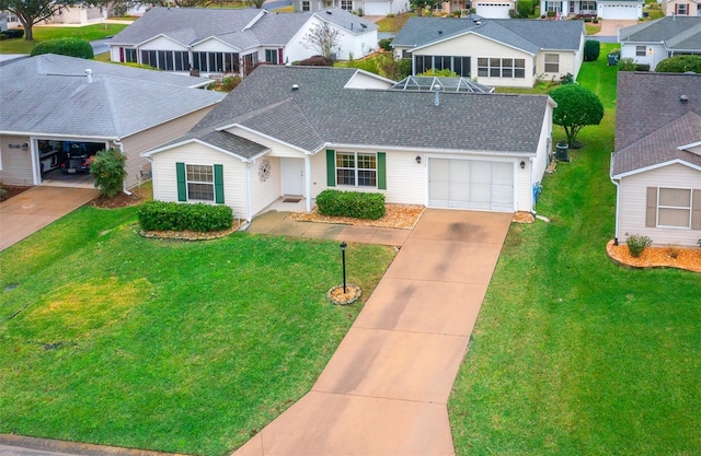 view of front of home featuring a garage and a front yard