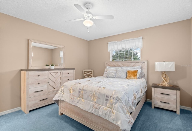 carpeted bedroom with a textured ceiling and ceiling fan