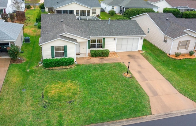 view of front of property with a garage and a front yard