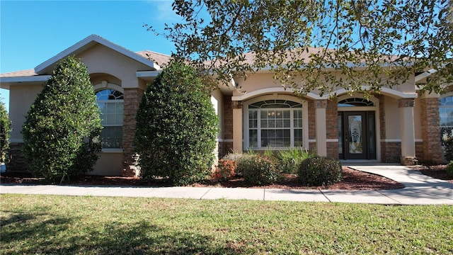 ranch-style house with a front yard