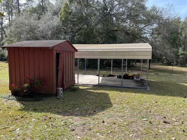 view of shed / structure with a yard and a carport