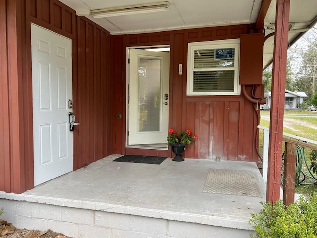 doorway to property featuring a porch