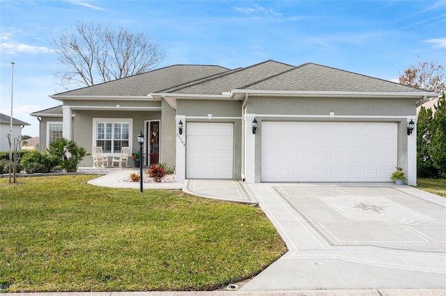 view of front of home featuring a front yard and a garage