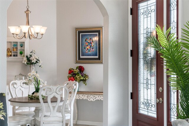 entrance foyer featuring an inviting chandelier