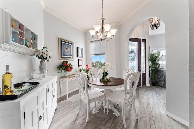 dining room featuring an inviting chandelier and ornamental molding