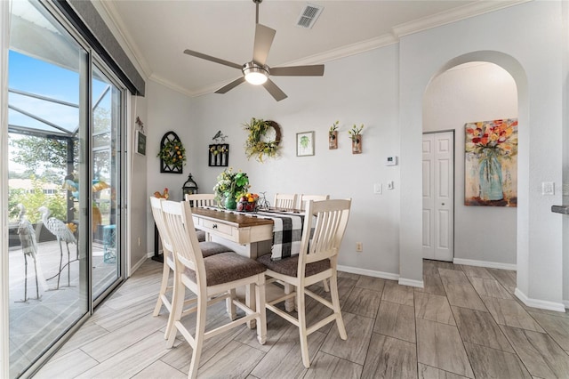 dining space featuring ceiling fan and ornamental molding