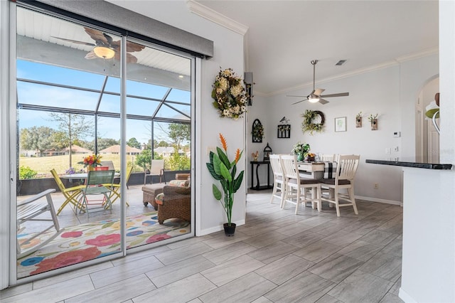 dining area featuring ornamental molding and ceiling fan