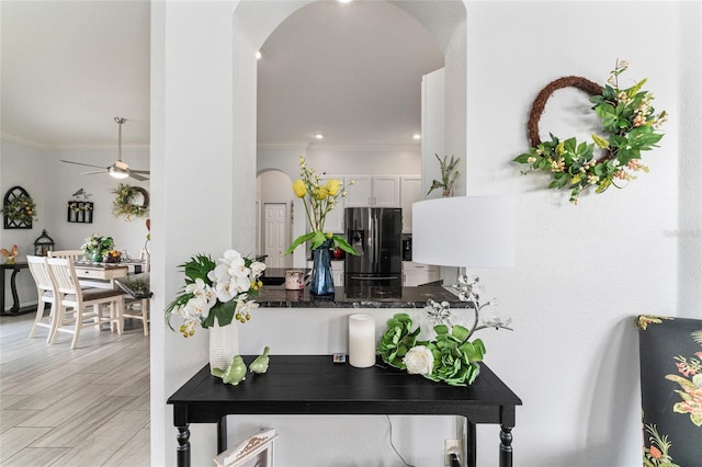 interior space featuring light hardwood / wood-style floors and ornamental molding