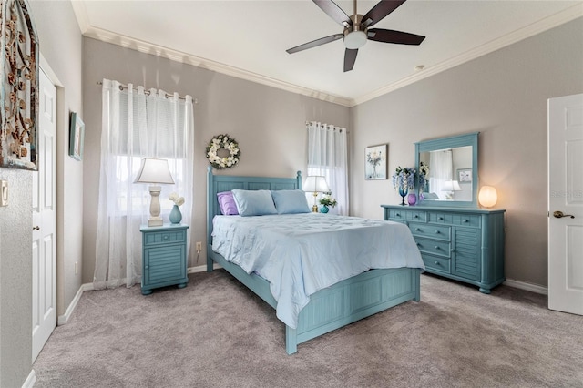 carpeted bedroom with crown molding and ceiling fan