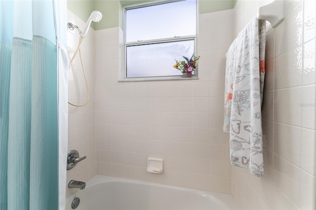 bathroom featuring shower / bathtub combination with curtain