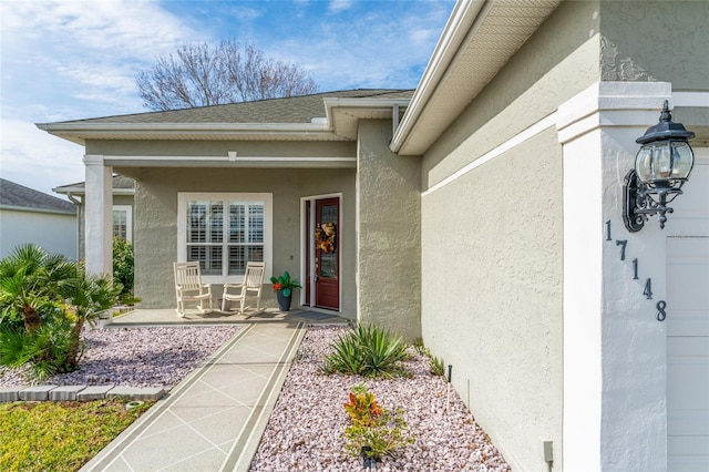 property entrance featuring a patio