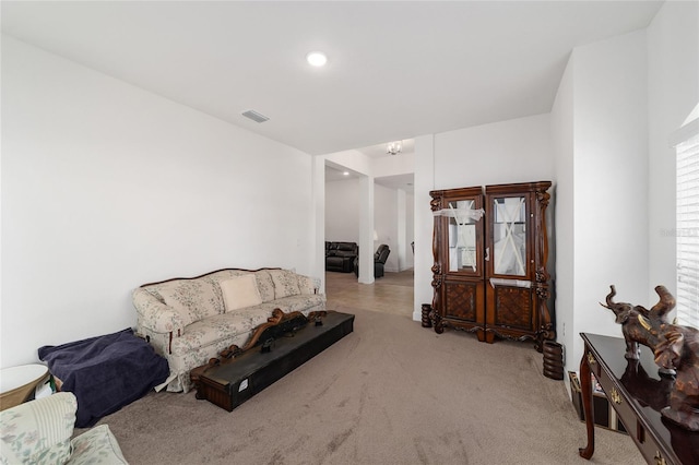 living room featuring light carpet