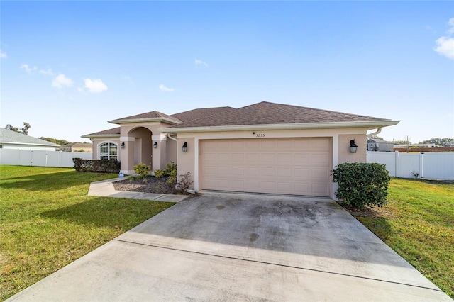 view of front facade featuring a front yard and a garage