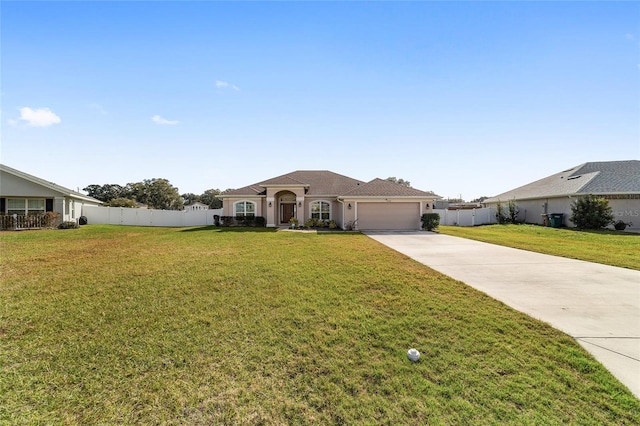 view of front of house with a front yard and a garage