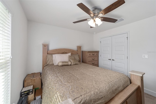 bedroom with carpet, a closet, and ceiling fan