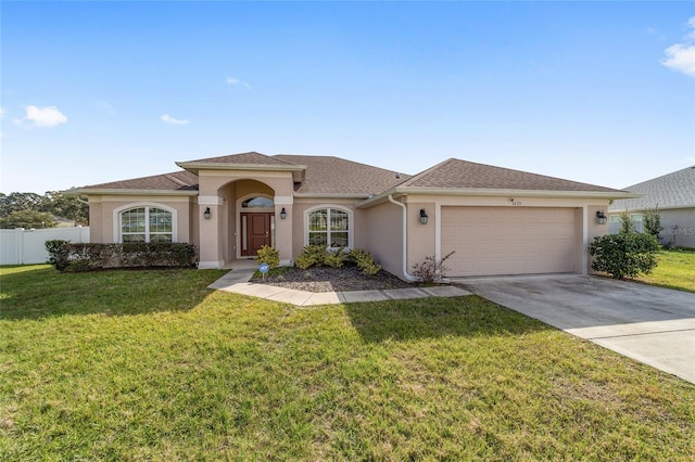 view of front facade featuring a front lawn and a garage