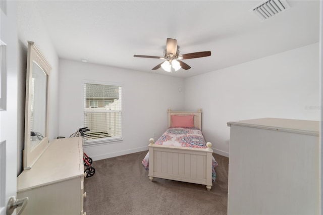 bedroom featuring dark carpet and ceiling fan