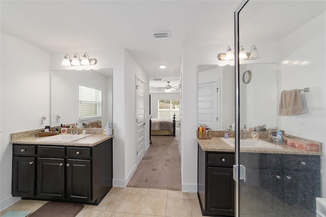 bathroom with plenty of natural light, ceiling fan, large vanity, and tile flooring