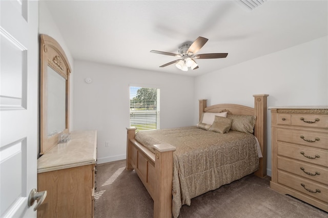 bedroom with ceiling fan and dark carpet