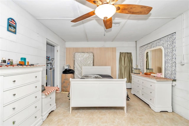 bedroom featuring ceiling fan and light tile floors