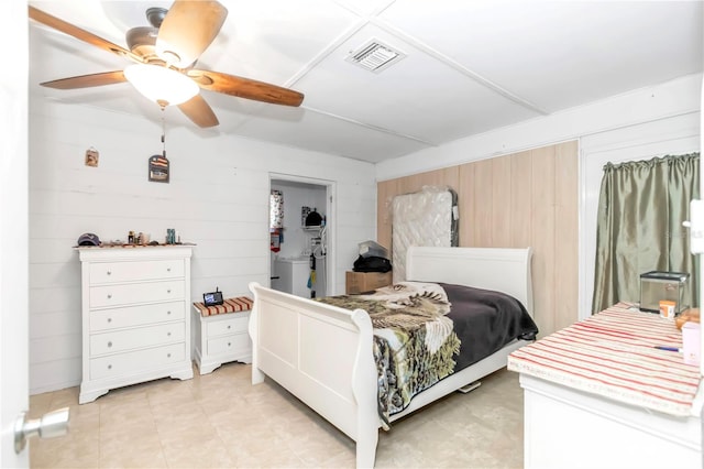 tiled bedroom with ceiling fan