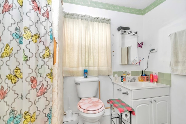 bathroom with vanity and toilet