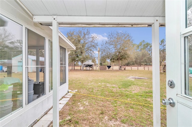 view of yard featuring a gazebo and a sunroom