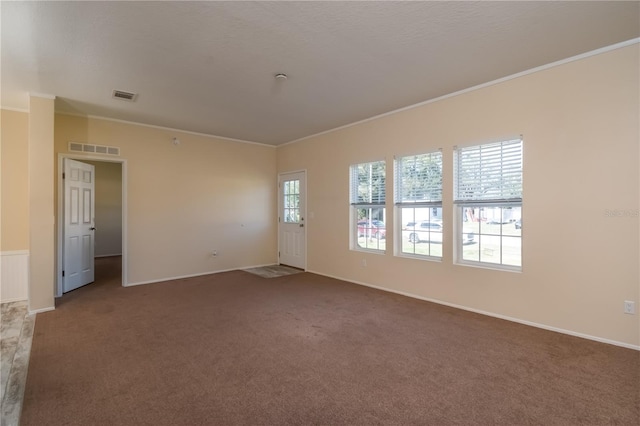 spare room with carpet floors and ornamental molding