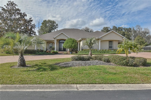 ranch-style house with a front lawn