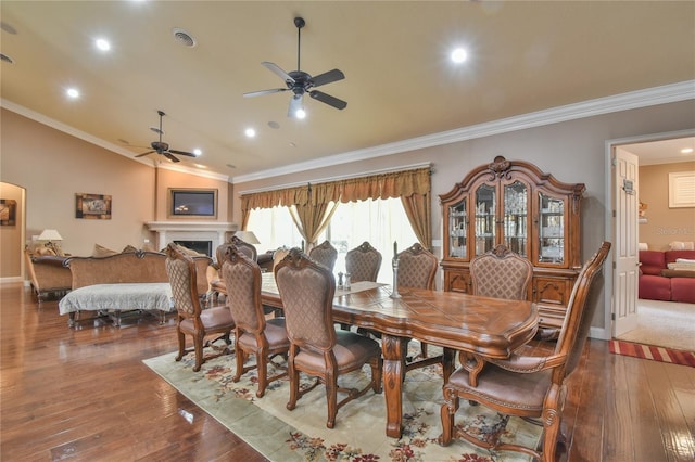 dining room featuring ornamental molding, lofted ceiling, hardwood / wood-style flooring, and ceiling fan