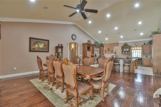 dining area with lofted ceiling, hardwood / wood-style floors, ceiling fan, and crown molding