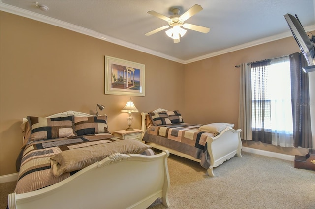 bedroom with ornamental molding, ceiling fan, and carpet floors