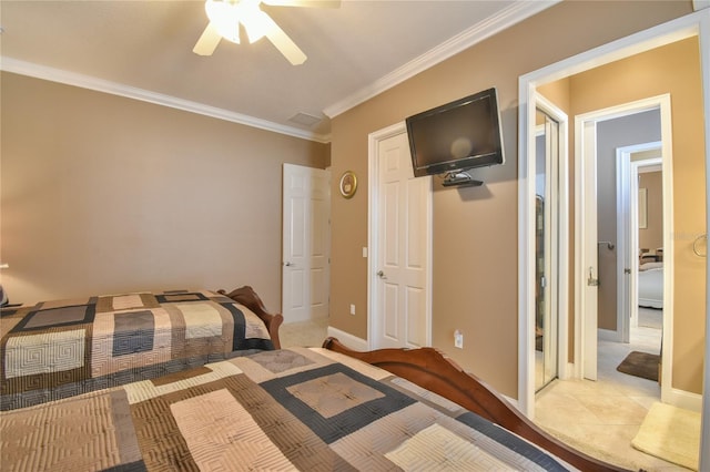 tiled bedroom with ornamental molding and ceiling fan